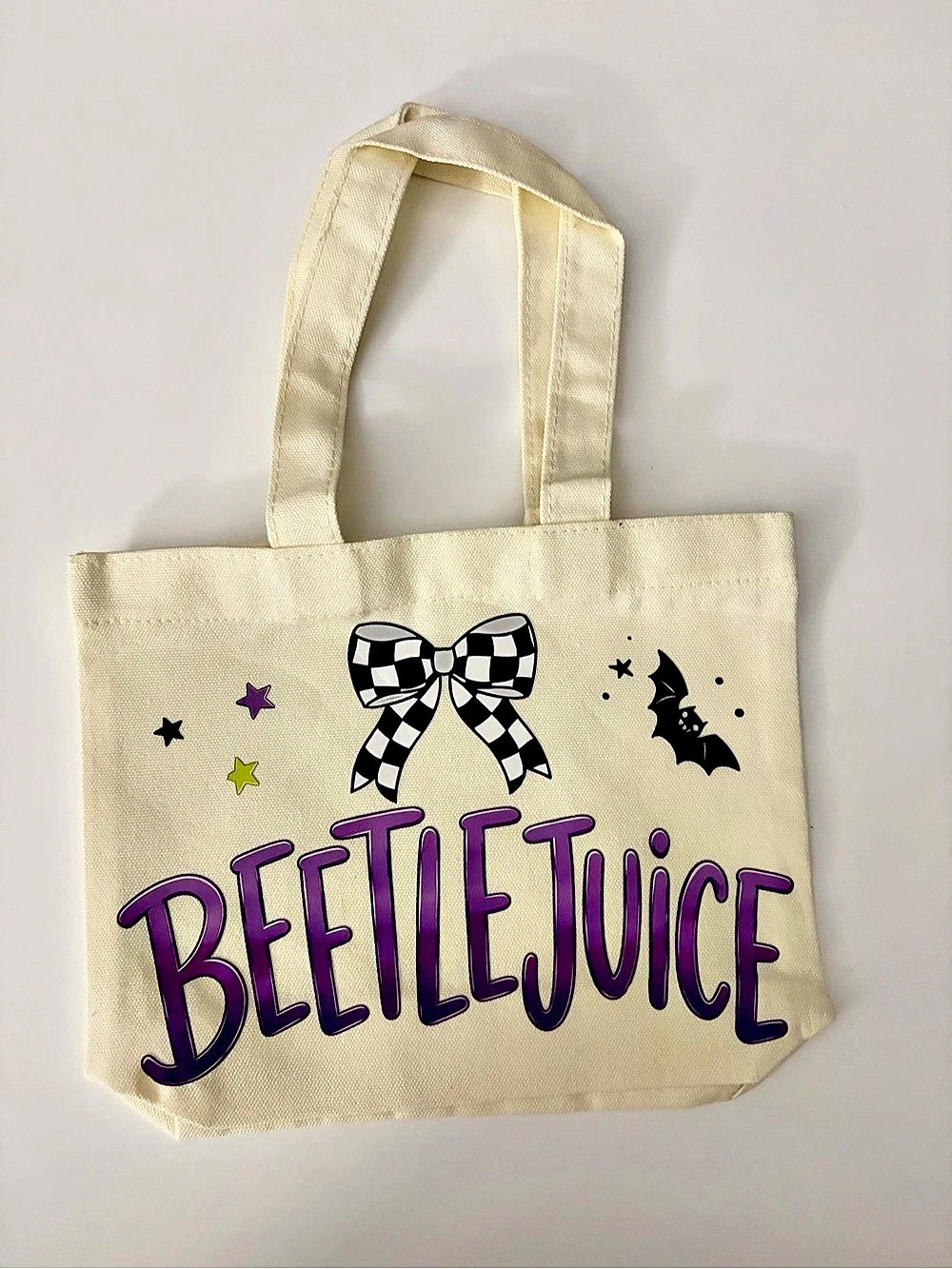 Beetlejuice Graphic Tote Bag in Cream & Purple